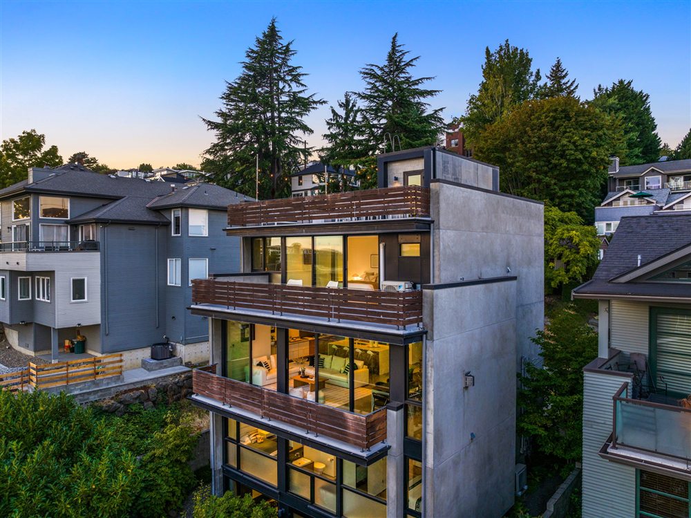 Multi-level decks and walls of glass at dusk